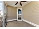 Screened in porch area featuring an outdoor exit door and ceiling fan at 840 Franklin Mill Trce, Loganville, GA 30052