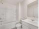 Clean bathroom with a shower-tub combo and a well-lit vanity area at 1088 Blue Juniper Cir, Loganville, GA 30052
