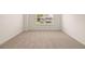 Bedroom featuring neutral carpet and natural light from a window at 1088 Blue Juniper Cir, Loganville, GA 30052
