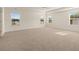 Spacious main bedroom features carpet flooring and lots of natural light at 1088 Blue Juniper Cir, Loganville, GA 30052
