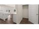 Open pantry with shelving and hardwood floors off the kitchen at 1088 Blue Juniper Cir, Loganville, GA 30052