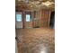 Unfinished basement space with exposed ceiling insulation and a door leading to the outside at 2530 Gold Creek Ln, Cumming, GA 30041