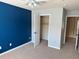 Bedroom with closet and blue accent wall at 2530 Gold Creek Ln, Cumming, GA 30041