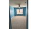 Bright bedroom featuring a large window and neutral carpet at 2530 Gold Creek Ln, Cumming, GA 30041