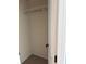 Small empty walk-in closet featuring white metal storage system at 2530 Gold Creek Ln, Cumming, GA 30041