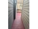 View between homes of the backyard deck with a wet floor after the rain at 2530 Gold Creek Ln, Cumming, GA 30041