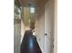 Bright hallway with hardwood floors and doors leading to various rooms at 2530 Gold Creek Ln, Cumming, GA 30041