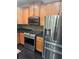 Modern kitchen with stainless steel appliances, including a gas range and refrigerator at 2530 Gold Creek Ln, Cumming, GA 30041