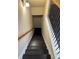Dark wood staircase with carpeted stairs and decorative railing at 2530 Gold Creek Ln, Cumming, GA 30041