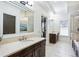 This primary bathroom features a double-sink vanity, a view to the bathtub, and modern fixtures at 4 Candler Grove Dr, Decatur, GA 30030
