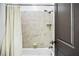 This bathroom features a tiled shower, a tub, and neutral colors at 4 Candler Grove Dr, Decatur, GA 30030