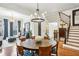 Elegant dining room with hardwood floors and a staircase in the background at 4 Candler Grove Dr, Decatur, GA 30030