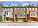 Charming townhome with brick facade, dormers, and attached garages in a well-maintained community at 4 Candler Grove Dr, Decatur, GA 30030