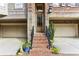Inviting front entrance with brick steps, potted plants, and black railings at 4 Candler Grove Dr, Decatur, GA 30030