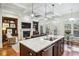 Open-concept design connects the kitchen island to the living area with fireplace at 4 Candler Grove Dr, Decatur, GA 30030