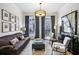 Sophisticated living room with stylish furniture, artwork, and natural light at 4 Candler Grove Dr, Decatur, GA 30030