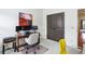 Bright office featuring built-in bookshelves, dual-monitor workstation, and natural light from two large windows at 4 Candler Grove Dr, Decatur, GA 30030