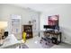 Bright office featuring built-in bookshelves, dual-monitor workstation, and natural light from two large windows at 4 Candler Grove Dr, Decatur, GA 30030