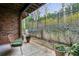 Private patio with brick accents, lush landscaping, and a seating area ideal for outdoor enjoyment at 4 Candler Grove Dr, Decatur, GA 30030