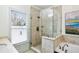 This bathroom features a glass shower, a window, and neutral colors at 4 Candler Grove Dr, Decatur, GA 30030