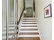 Elegant staircase with white risers, wooden steps, and a glass door at 4 Candler Grove Dr, Decatur, GA 30030