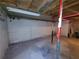 An unfinished basement with painted cinder block walls and painted support beams at 74 Sandy Path, Rockmart, GA 30153