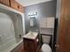 Cozy bathroom with tub and shower, and built in storage for towels and toiletries at 74 Sandy Path, Rockmart, GA 30153