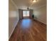 Spacious bedroom featuring hardwood floors, neutral walls, a ceiling fan, and a bright window at 74 Sandy Path, Rockmart, GA 30153