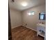 Bright laundry room with a window and classic porcelain sink at 74 Sandy Path, Rockmart, GA 30153