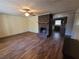 Spacious living area featuring a brick fireplace and wood flooring at 74 Sandy Path, Rockmart, GA 30153