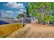 This spacious backyard has green grass and a wooden fence under a partly cloudy sky at 1340 Aster Ives Dr, Lawrenceville, GA 30045