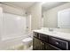 This bathroom showcases a shower-tub combo, toilet, and vanity with a modern sink at 1340 Aster Ives Dr, Lawrenceville, GA 30045