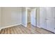 This bedroom offers wood floors, a double-door closet, and ample natural light at 1340 Aster Ives Dr, Lawrenceville, GA 30045
