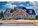 This clubhouse has a beautiful stone front entrance and is surrounded by green landscaping at 1340 Aster Ives Dr, Lawrenceville, GA 30045