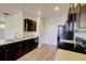 Modern kitchen with black appliances, light countertops and hardwood flooring at 1340 Aster Ives Dr, Lawrenceville, GA 30045