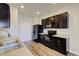 Modern kitchen with black appliances, light countertops and hardwood flooring at 1340 Aster Ives Dr, Lawrenceville, GA 30045