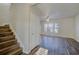 Bright living room featuring wood-look floors, staircase, and large windows for natural light at 1340 Aster Ives Dr, Lawrenceville, GA 30045