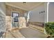 Inviting patio with brick accents and wooden railing perfect for outdoor relaxation and entertaining at 1340 Aster Ives Dr, Lawrenceville, GA 30045