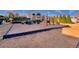Community playground with various play structures, swings, and climbing apparatus, bordered by trees and grass at 1340 Aster Ives Dr, Lawrenceville, GA 30045