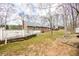 A view of the spacious backyard, showing the deck, house exterior, and natural surroundings at 1376 Highway 138 E, Stockbridge, GA 30281