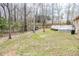 A spacious yard with a deck and mature trees at 1376 Highway 138 E, Stockbridge, GA 30281