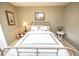 Comfortable bedroom with a neatly made bed, bedside tables, lamps, and decorative wall art at 1376 Highway 138 E, Stockbridge, GA 30281