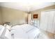 Bright bedroom with bed, closet, dresser and decoratively placed side tables at 1376 Highway 138 E, Stockbridge, GA 30281