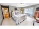 Bright bedroom with soft carpet, white bed frame, and natural light from the window at 1376 Highway 138 E, Stockbridge, GA 30281