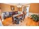 View of the dining room with hardwood floors, chandelier, and dark wood furniture at 1376 Highway 138 E, Stockbridge, GA 30281