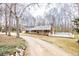 Charming one-story brick home with a welcoming front porch and circular driveway at 1376 Highway 138 E, Stockbridge, GA 30281