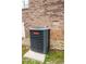 An exterior shot of the Goodman HVAC unit next to the brick wall of the house at 1376 Highway 138 E, Stockbridge, GA 30281