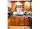 Close up of the kitchen cook top, cabinets, granite counters, and hardwood floors at 1376 Highway 138 E, Stockbridge, GA 30281