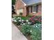 Lovely landscaping with colorful blooms enhances the front of the home at 1376 Highway 138 E, Stockbridge, GA 30281