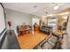 Spacious living room area with hardwood floors, a piano, black leather couches, and a projector screen at 1376 Highway 138 E, Stockbridge, GA 30281